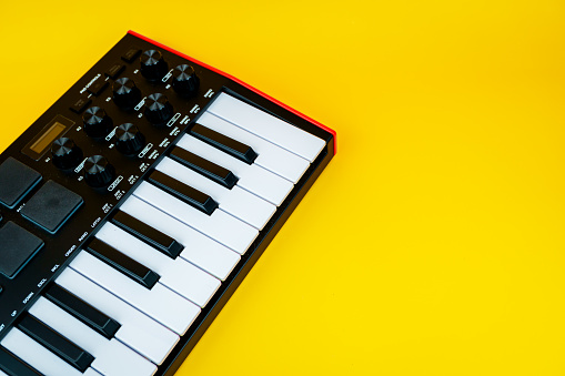 Piano keys on a yellow background