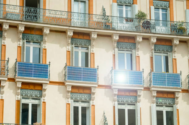 Solar panels on building balconies Solar panels installed on balconies of apartment buildings solar panels on the roof of building in a city stock pictures, royalty-free photos & images