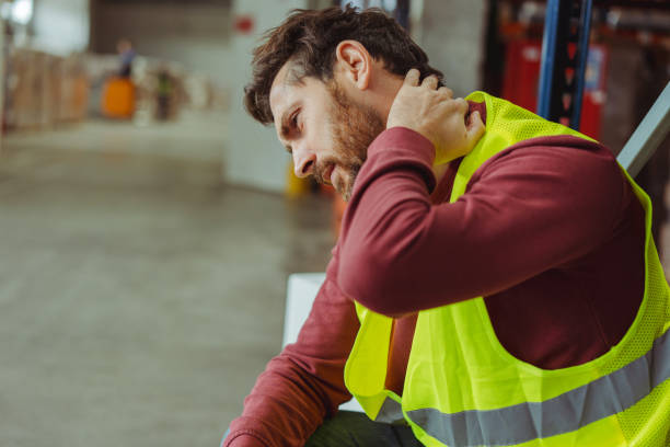 istock Tired upset, sick bearded man, worker having neck and back pain, after work in warehouse, copy space 2149277513