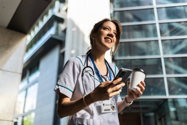 istock Young Nurse Woman Taking a Phone Break at Clinic 2149277566