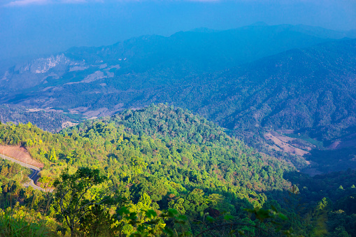 Morning panorama of woodlands and mountains in Chiang Rai province near Ban Hae between Chiang Rai and Phayao