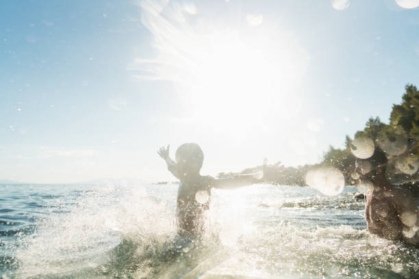 Video of an adventurous young boy spending some quality time with his father while they're vacationing together by the sea