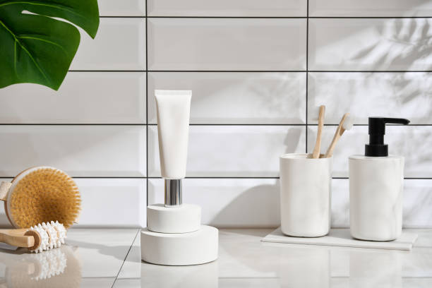 istock Bathroom concept with towel, toothbrushes, white tile wall background. 2149280377