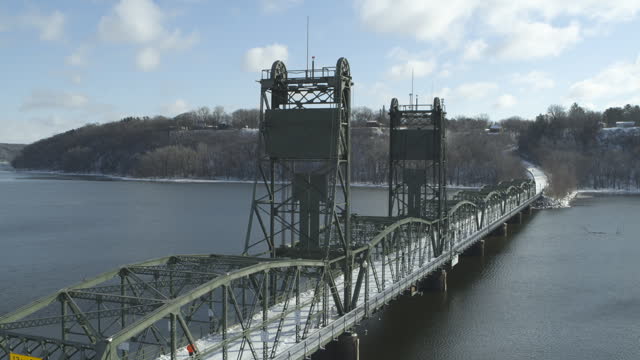 Aerial orbit establisher historic lift bridge in Stillwater Minnesota, winter
