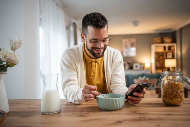 istock Adult man eating cornflakes with milk for breakfast 2149281952
