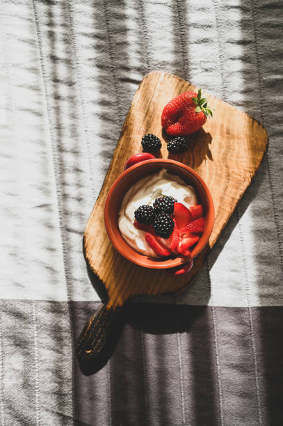 istock Greek yogurt with berries top view. 2149283279