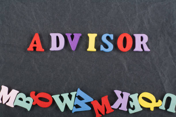 istock ADVISOR word on black board background composed from colorful abc alphabet block wooden letters, copy space for ad text. Learning english concept. 2149285313