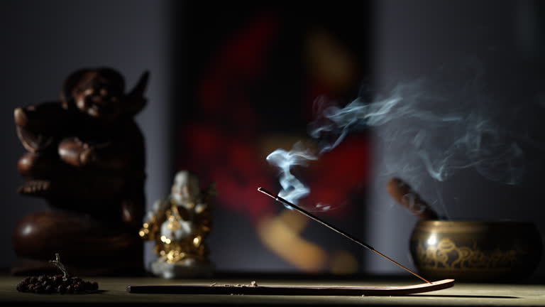 Asian incense stick in stick holder burning with smoke. Meditation concept