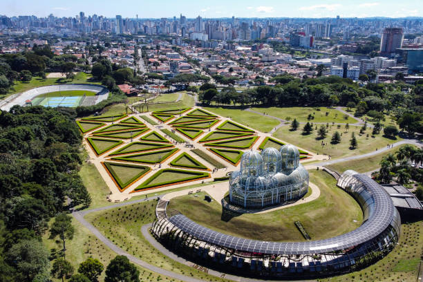 Plant greenhouse located in Curitiba, capital of the state of Parana, southern Brazil, known as Jardim Botanico, with various types of plants, in the background the city.