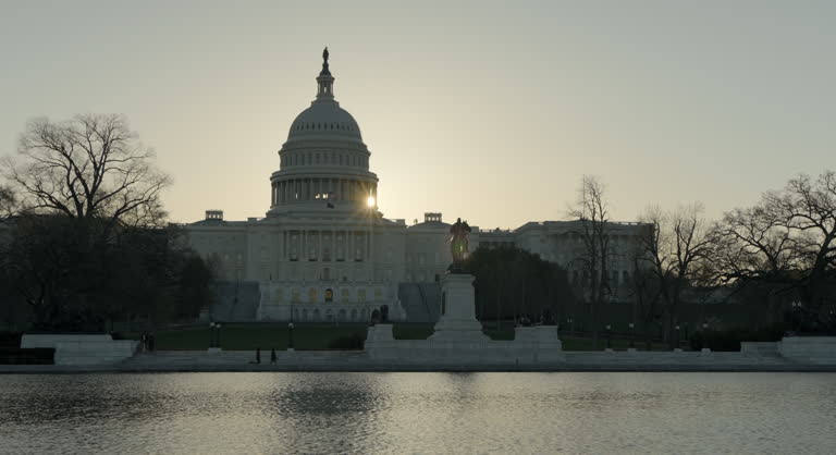Sun Coming Out From Behind U.S. Capitol Dome at Sunrise