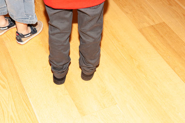 istock From the waist backs of two standing boys 2149293967