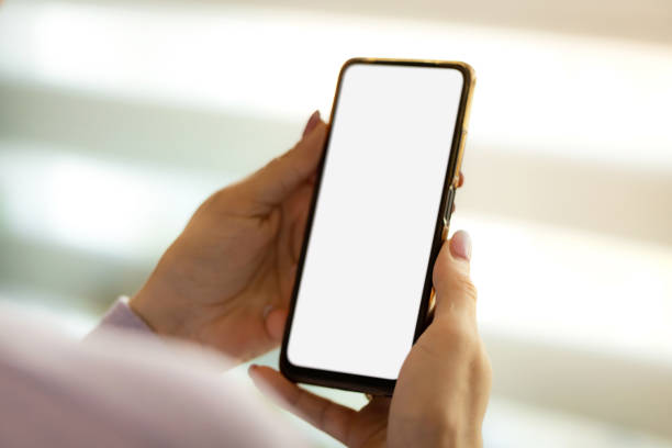 istock Close-up of hands holding phone 2149296177