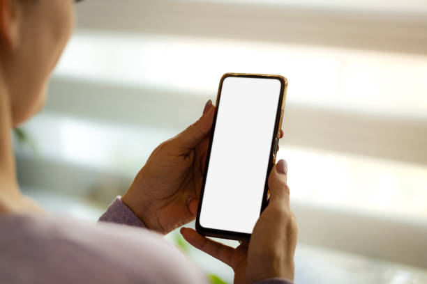 istock Close-up of hands holding phone 2149296182