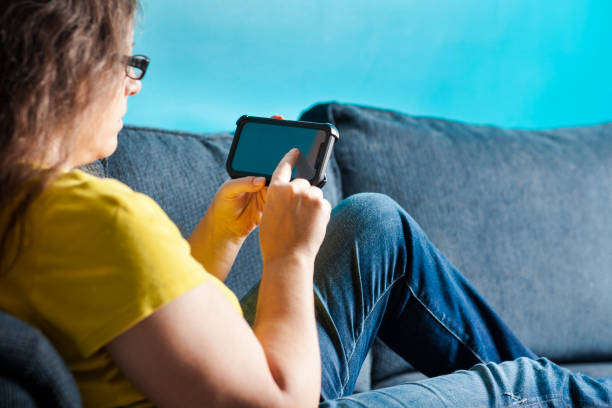 Woman Touching the Screen on a Smart Phone