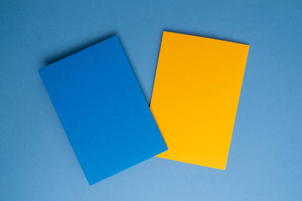 istock Paper yellow and blue envelopes on a light background. New mail, write a message. Send and receive mail. Postal delivery service. Empty envelope, empty space. Envelope close-up 2149297899