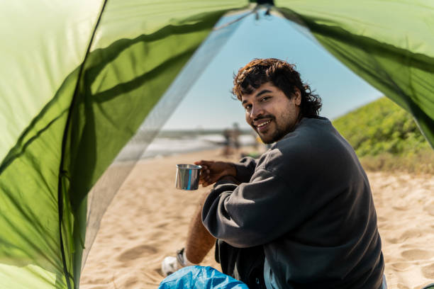 istock Portrait of a young man on the beach 2149299298