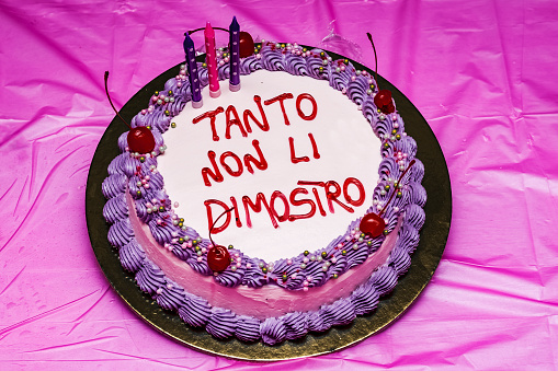 a birthday cake decorated with cream and the phrase: 