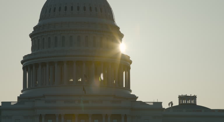 U.S. Capitol Dome Silhouetted with Sunrise Appearing