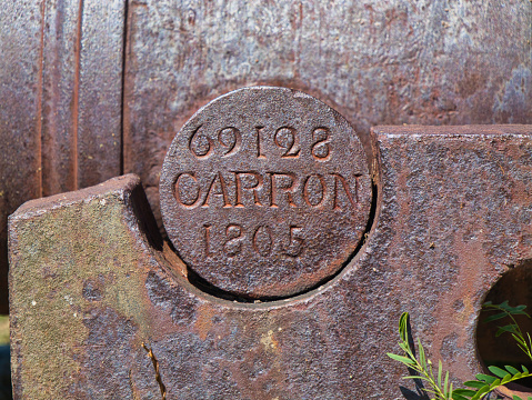Antigua - Jan 26 2024: A serial number and the date 1805 marked on a cannon at Fort James on Antigua in the Caribbean. Oarron possibly the Oarron Factory, Scotland where the gun may have been cast.