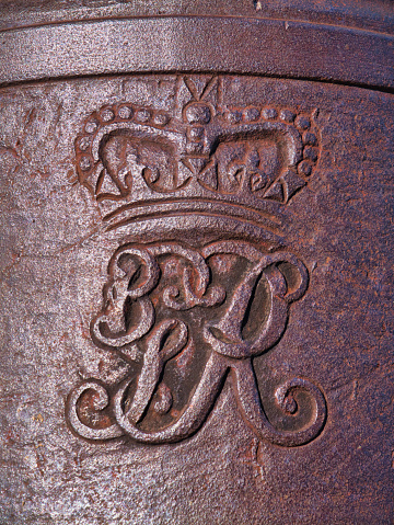 Antigua - Jan 26 2024: The Royal insignia of King George 2nd on a cannon at Fort James on the island of Antigua in the Caribbean.