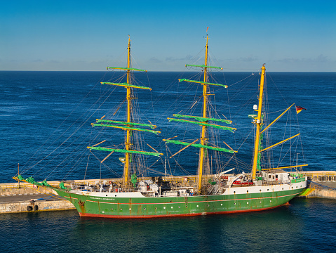 Bridgetown, Barbados - Jan 28 2024: The three masted square rigger Alexander von Humboldt 2, moored at the Port of Bridgetown, Barbados. Taken on a calm sunny morning with sunshine and a blue sky.