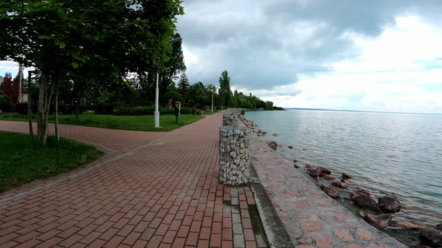 Brick Esplanade Along The Lake Balaton In Balatonfuzfo, Hungary. - wide shot