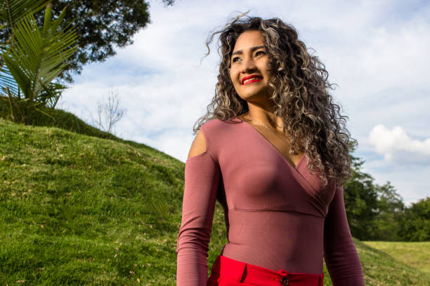 istock Beautiful young woman posing in a public park 2149305857