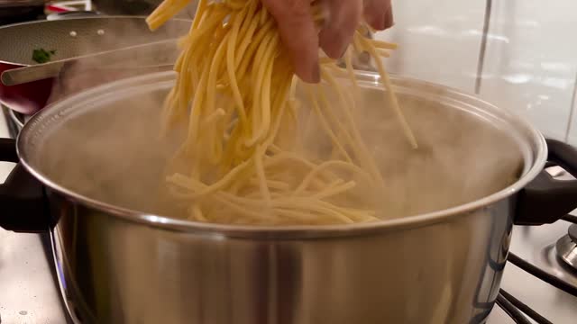 Putting pasta in hot water