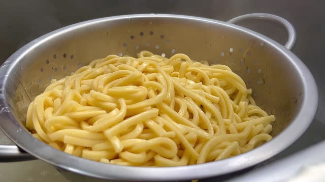 Placing the pasta in the draining pan