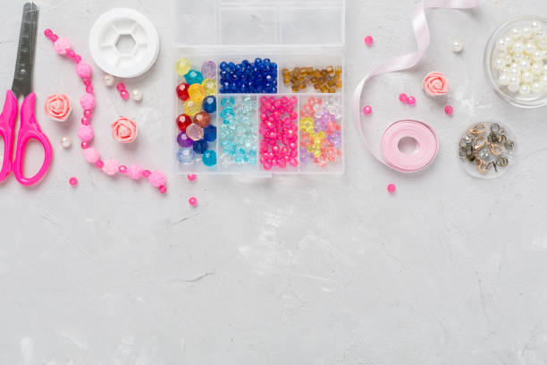 istock Tools and beads for making handmade jewelry on concrete background, top view 2149308711