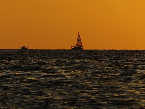 A boat bathed in the sunset