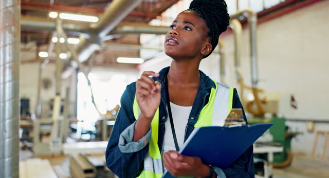 Writing, engineer or woman with clipboard in factory for checklist, planning and maintenance in warehouse. Civil engineering, female person and count with documents or pen for automation inspection