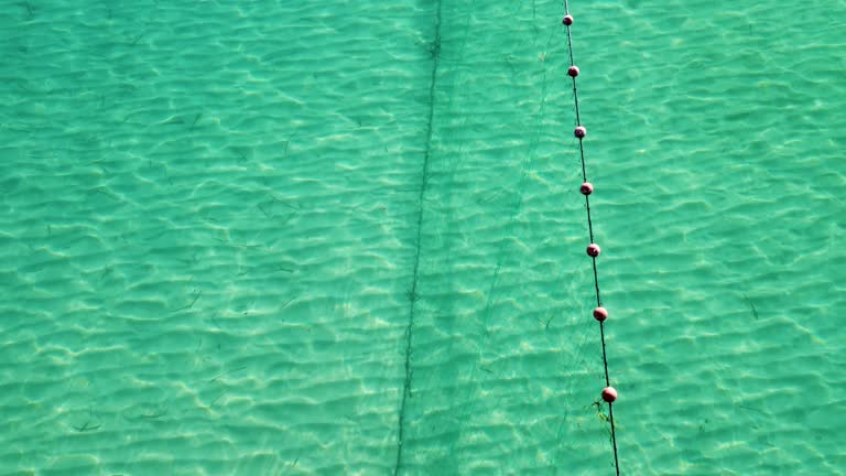 Net Fishing in the Aegean Sea: Aerial View of a Traditional Trap in Thessaloniki's Blue Waters.