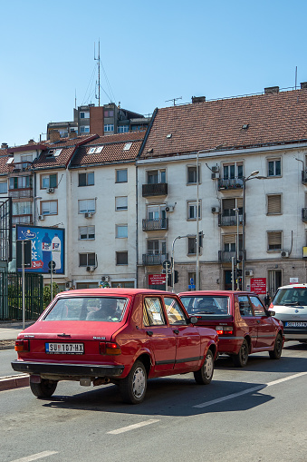 Typical balkan cars - red Zastava Scala 55 and Yugo Koral in street of Subotica, Serbia - 20.03.2024