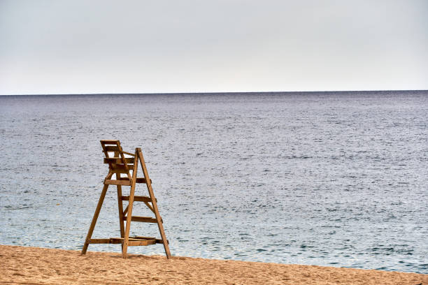 Lifeguard Chair on Sandy Beach Overlooking Calm Sea