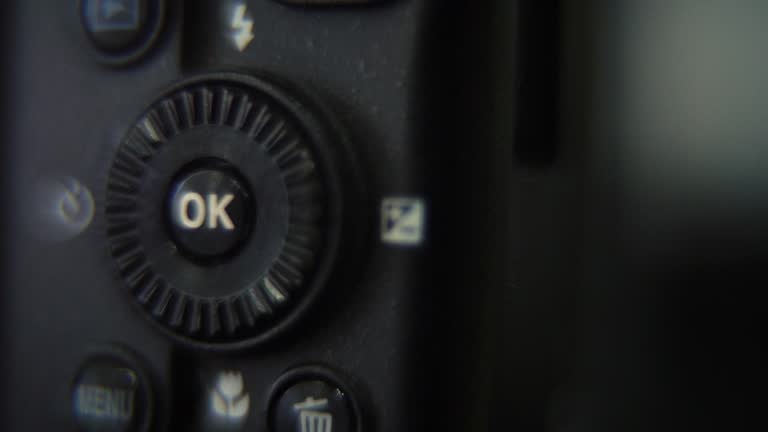 Macro shot of a DSLR camera, menu buttons close up, studio lighting, photography gear, slow motion 120 fps, Full HD video, pan right movement