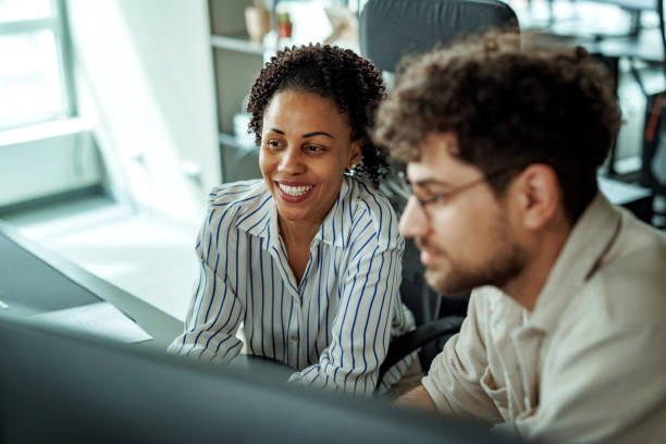istock Colleagues working together at the office 2149321234