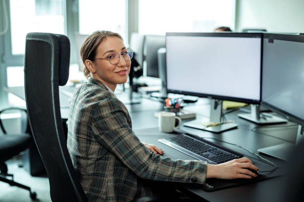 istock Young beautiful woman posing for a shot while working at the office 2149321242