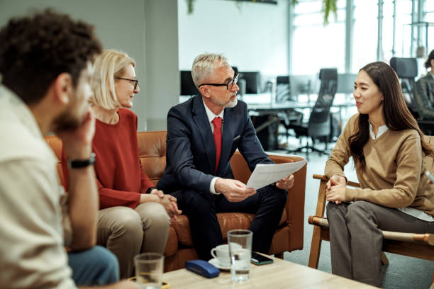 istock Colleagues talking during coffee break at the office 2149321389
