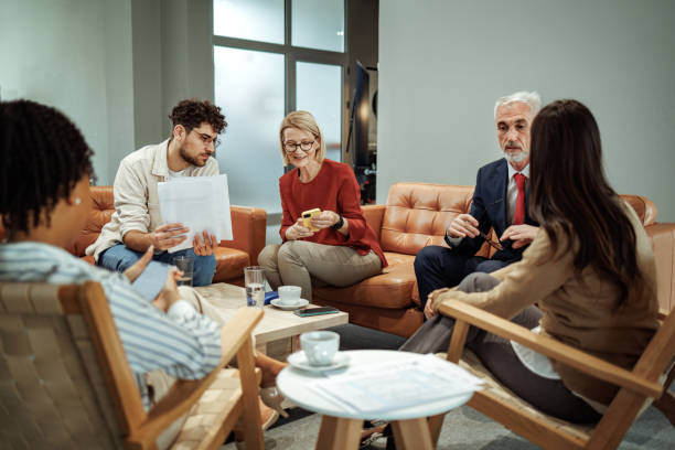 istock Colleagues talking during coffee break at the office 2149321411