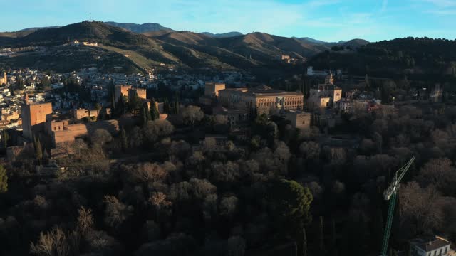 Palace And Fortress Complex Of Alhambra During Sunrise In Granada, Andalusia, Spain. Aerial Drone Shot