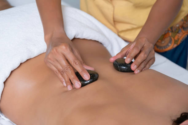 istock Thai massage with volcanic stones 2149323287