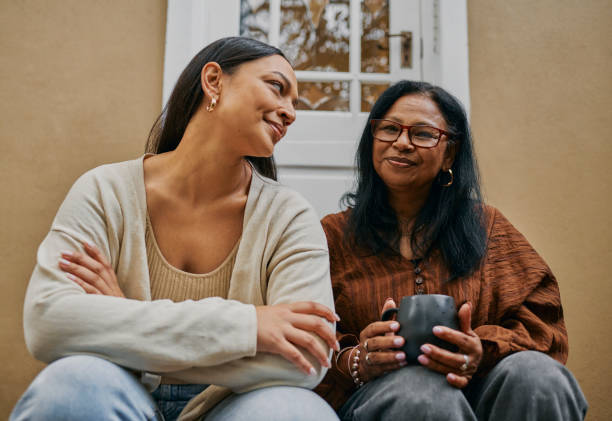 istock Heart-to-Heart: Mother-Daughter Conversation on the Stoop 2149327061
