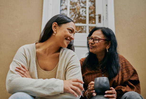 istock Heart-to-Heart: Mother-Daughter Conversation on the Stoop 2149327065