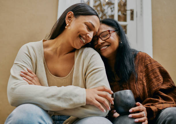 istock Heart-to-Heart: Mother-Daughter Conversation on the Stoop 2149327066
