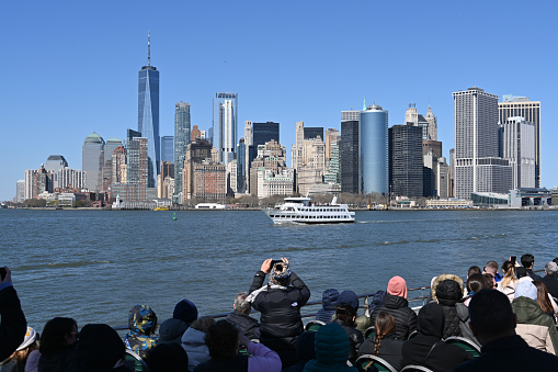New York, New York, USA, April 9, 2023 - Manhattan skyline seen from a ferry boat, New York.