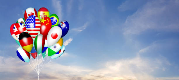 istock Colorful flag of different countries on ballon against blue sky with white cloud 2149328038
