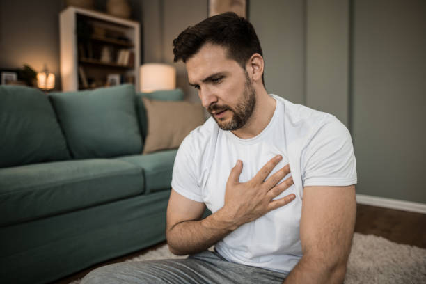 istock Mid adult man having heartache at home. 2149332291