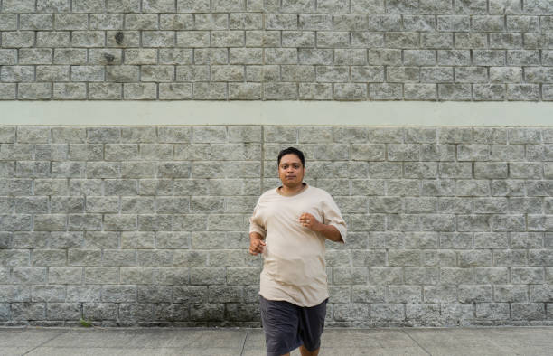 latin man running in the park outdoors