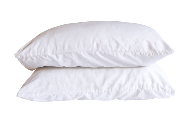istock Side view of white pillows with case in stack after guest's use in hotel or resort room isolated on white background with clipping path. Concept of comfortable and happy sleep in daily life 2149336095